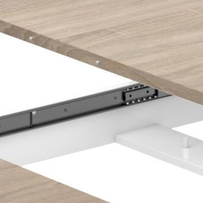 Mesa comedor extensible Kendra blacno y roble guías correderas para extender la mesa y cierres metálicos para el cierre